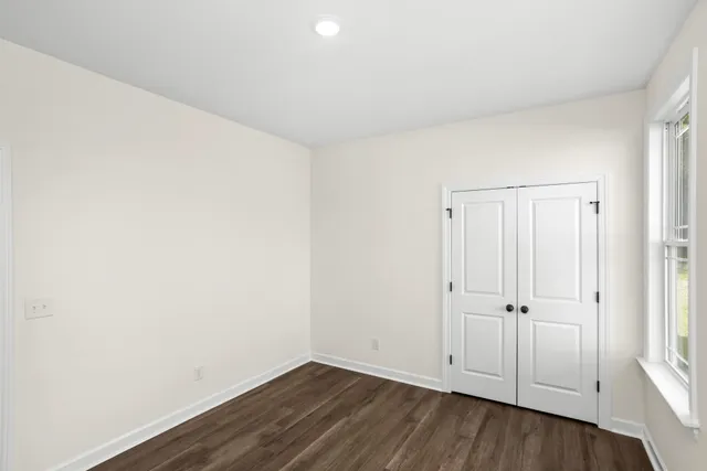 a bathroom with a sink a toilet and a large mirror