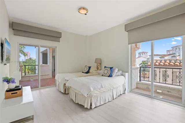 a bedroom with two beds and painted walls