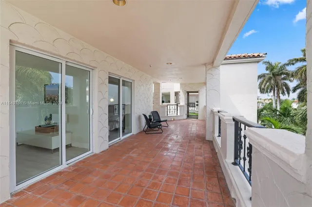 a picture of houses with outdoor space and lake view