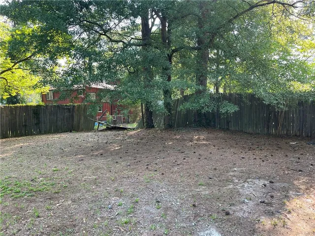 a backyard of a house with lots of green space