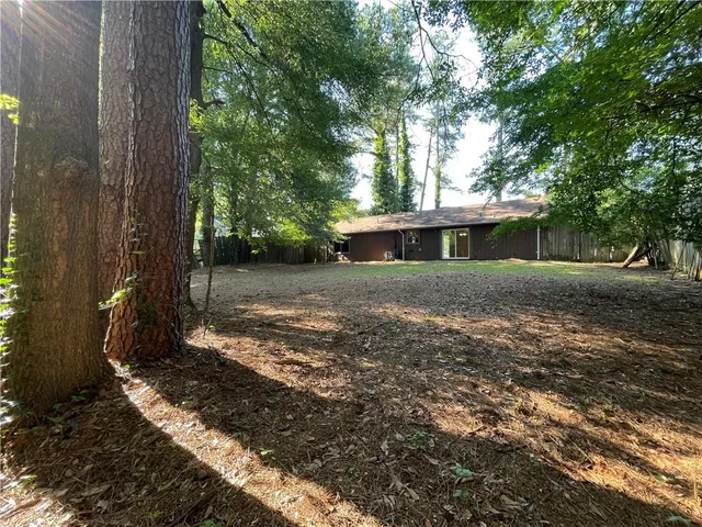 a view of a house with a yard