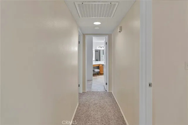 a view of a hallway with a white walls