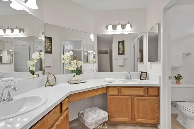 a bathroom with a sink double vanity and a mirror