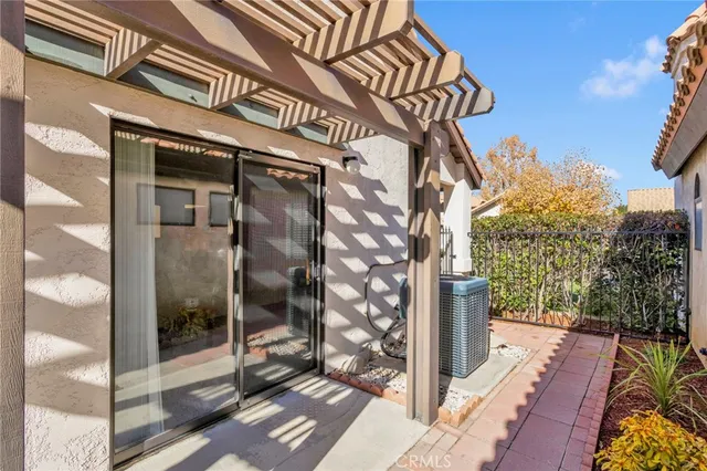 a view of a brick building with large windows