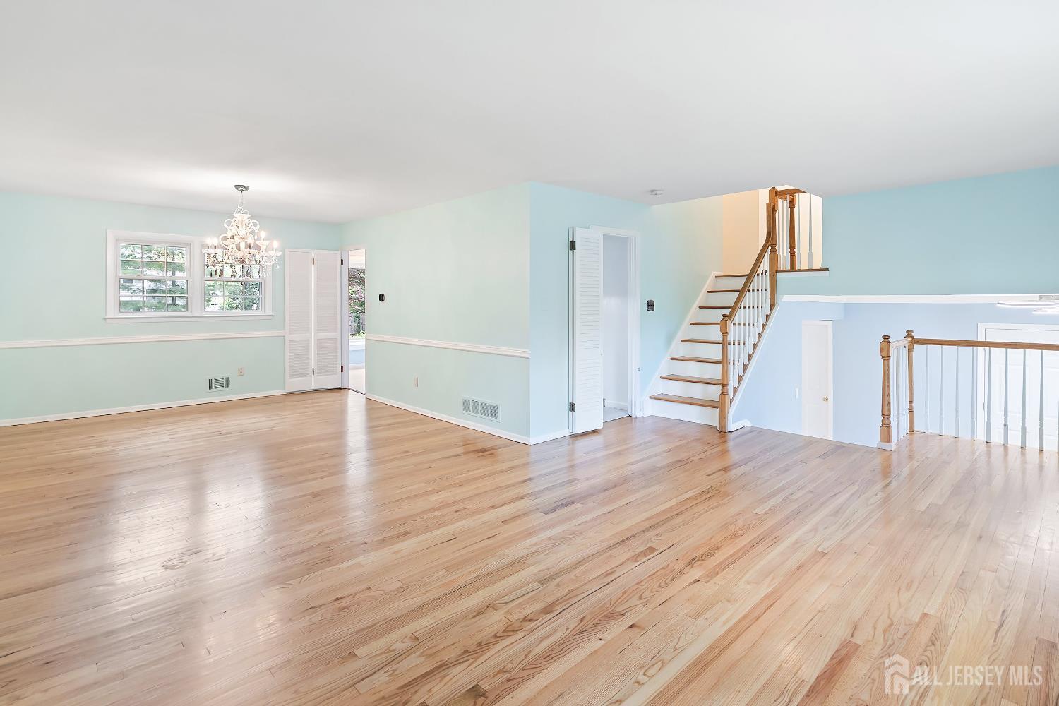 10 Woodruff Road Edison, NJ 08820 - Photo 4 of 18 wooden floor in an empty room with a window