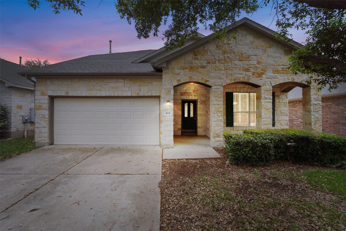 404 Arrowhead Trail Cedar Park, TX 78613 - Photo 1 of 1 a front view of a house with a yard and garage