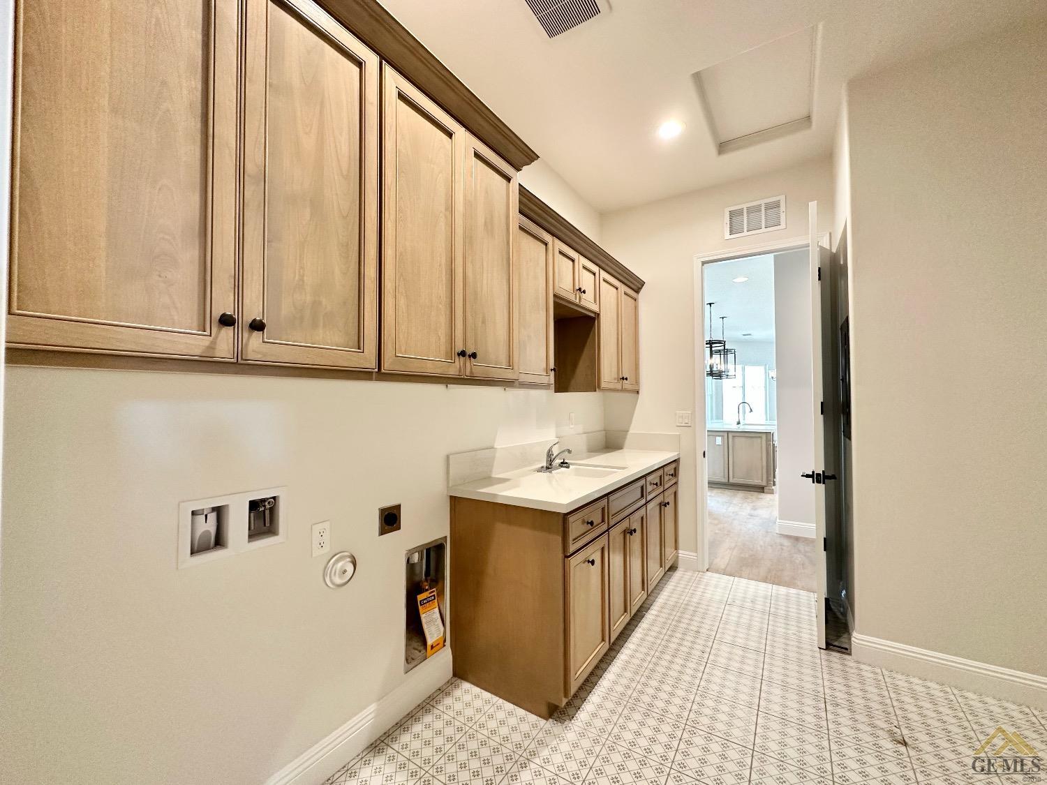 Undisclosed Address Bakersfield, CA 93314 - Photo 11 of 34 a kitchen with a sink stove and cabinets