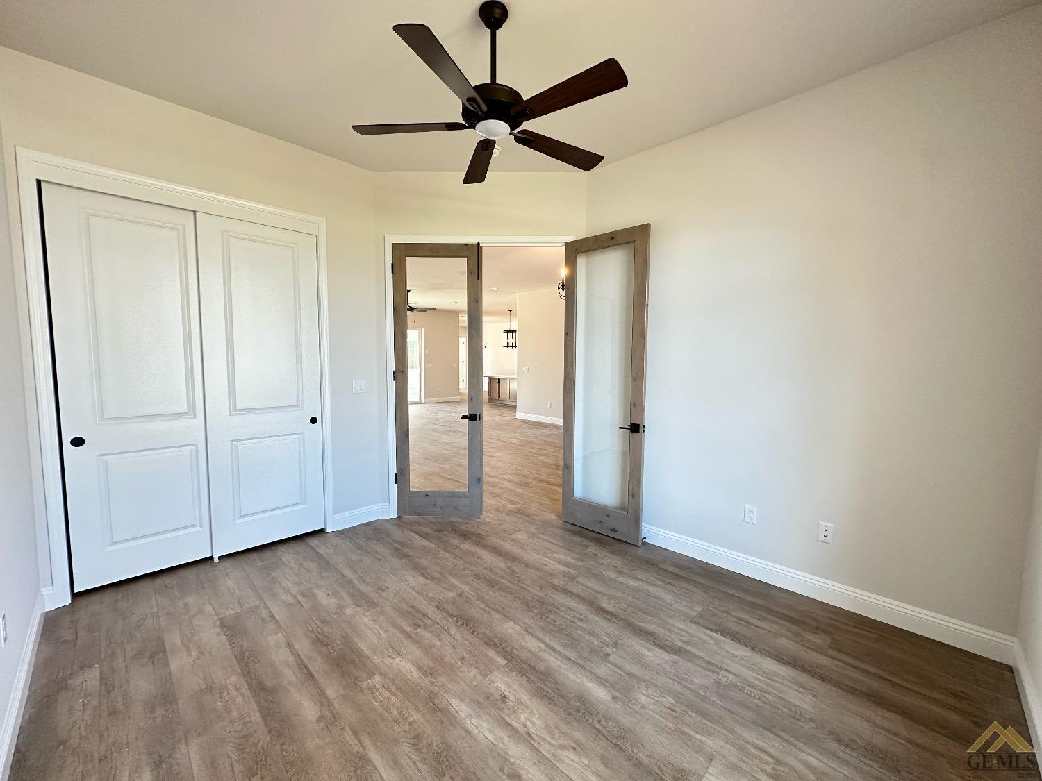 Undisclosed Address Bakersfield, CA 93314 - Photo 14 of 34 a view of empty room with wooden floor