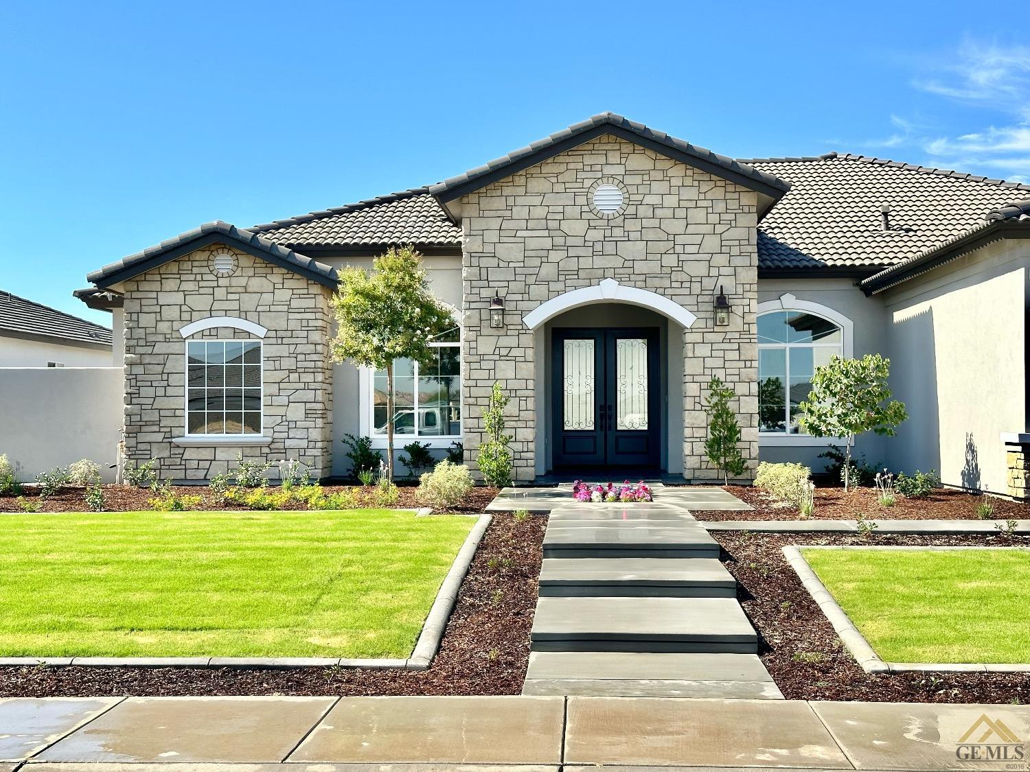 Undisclosed Address Bakersfield, CA 93314 - Photo 2 of 34 a front view of a house with a yard