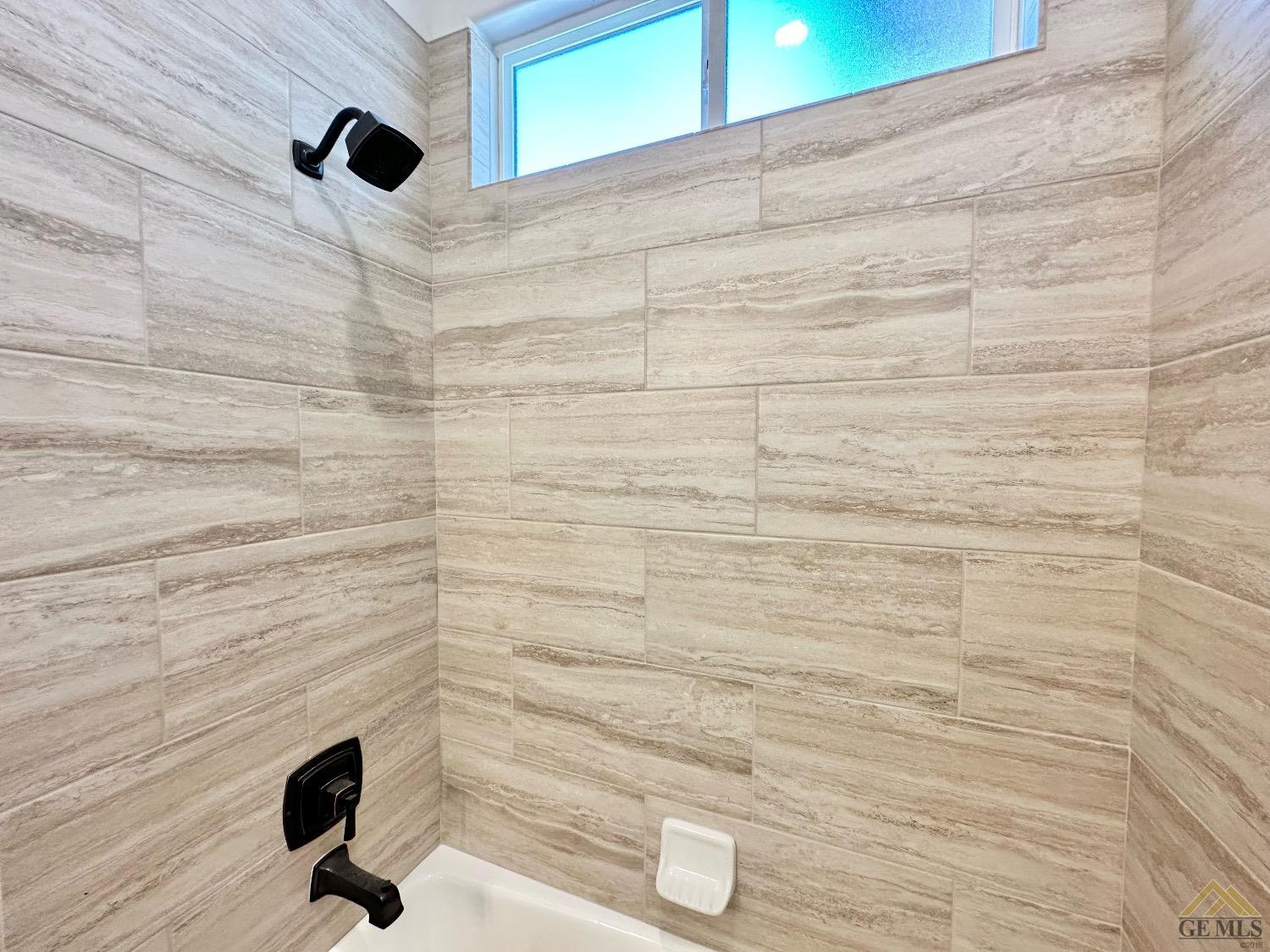 Undisclosed Address Bakersfield, CA 93314 - Photo 25 of 34 a bathroom with a shower