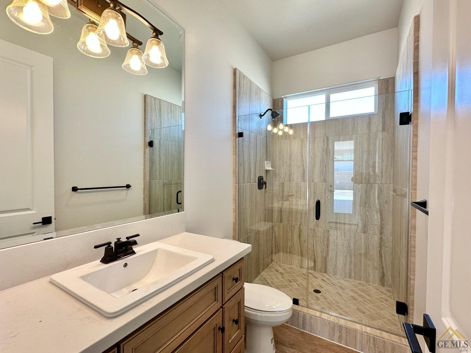 Undisclosed Address Bakersfield, CA 93314 - Photo 28 of 34 a bathroom with a sink a toilet and shower