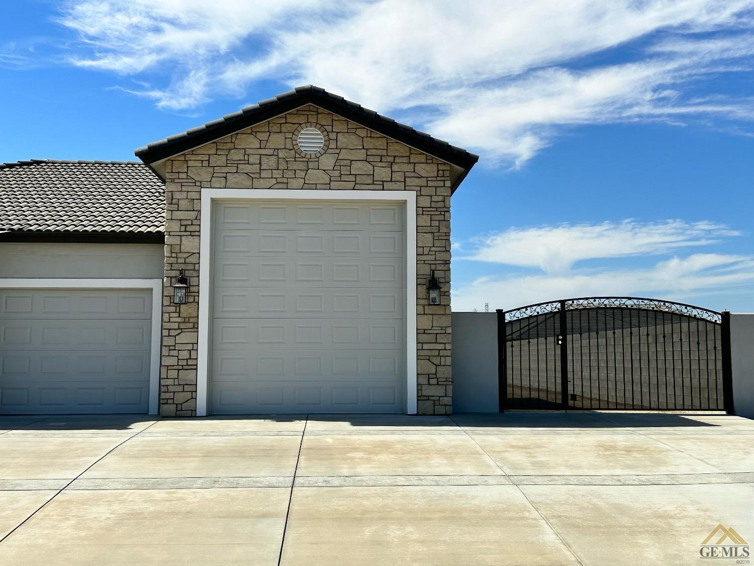Undisclosed Address Bakersfield, CA 93314 - Photo 34 of 34 a front view of a house with a garage