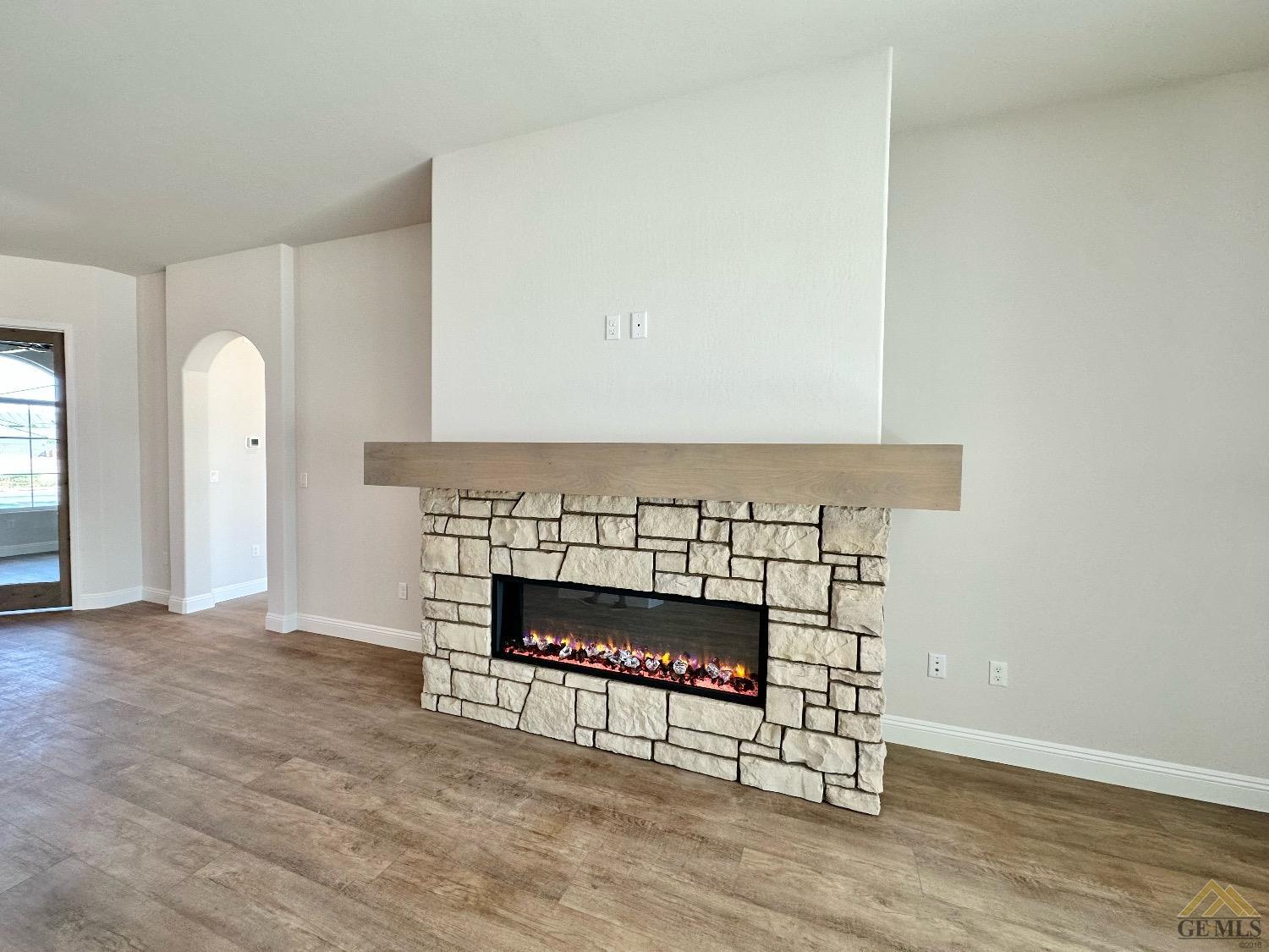 Undisclosed Address Bakersfield, CA 93314 - Photo 8 of 34 a living room with furniture and a fireplace