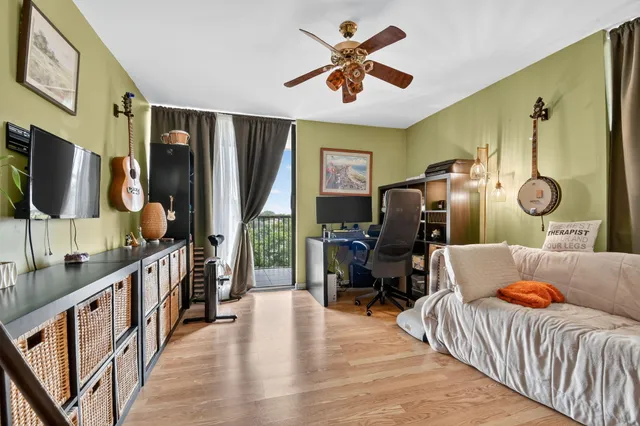 a bedroom with furniture and wooden floor