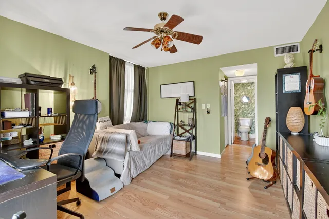 a work room with furniture and wooden floor
