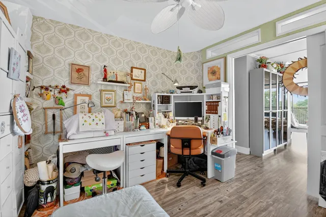 a view of a dining room with furniture and a chandelier