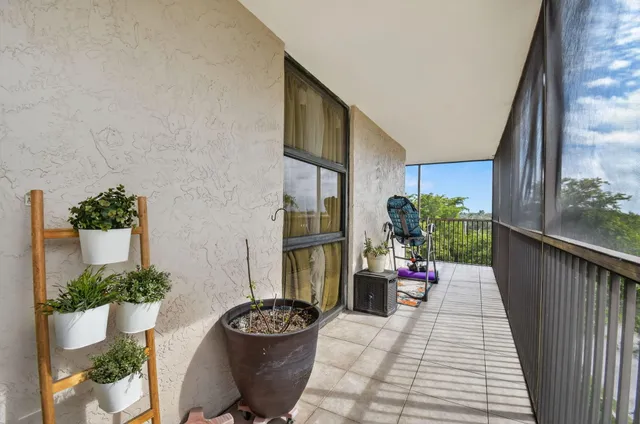 a very nice looking room with a large window and table