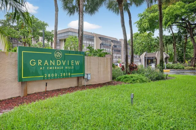 a living room with lots of furniture and gym equipment