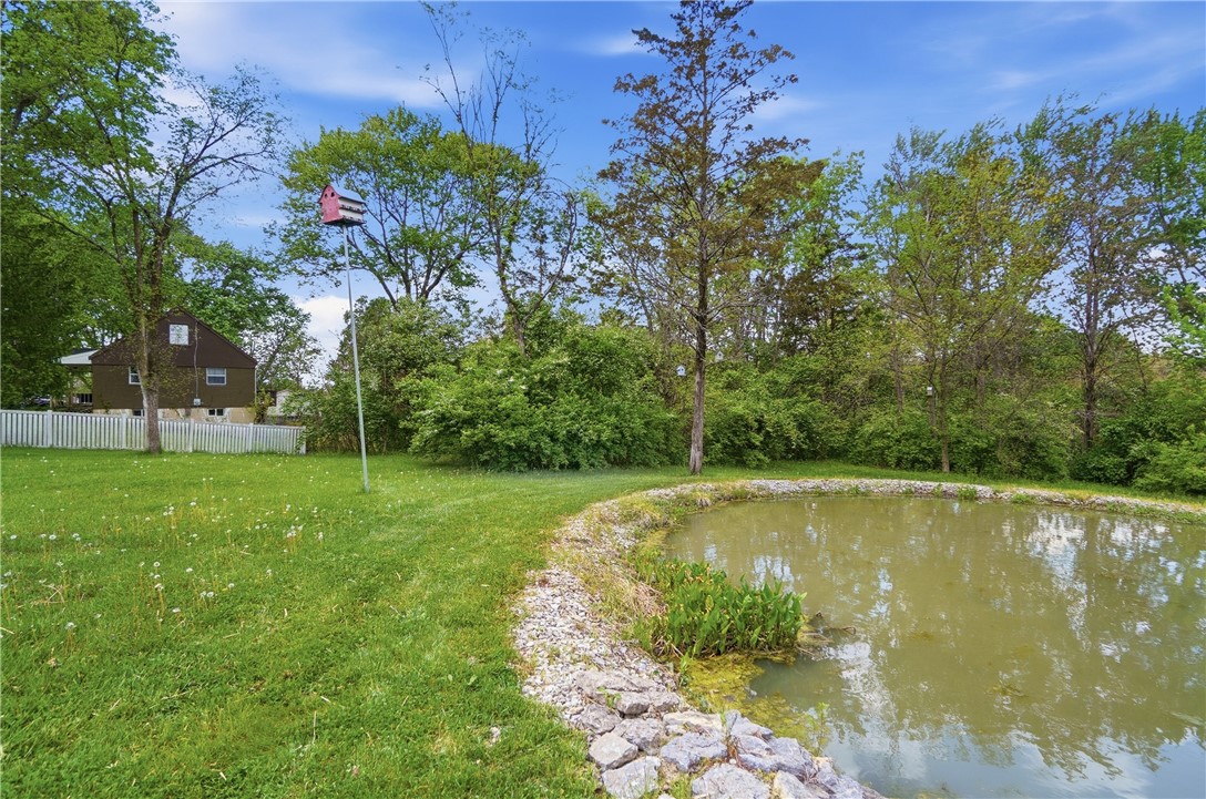 1208 Jarva Lane Springboro, OH 45066 - Photo 74 of 75 This verdant outdoor space offers a tranquil pond, perfect for serene moments.