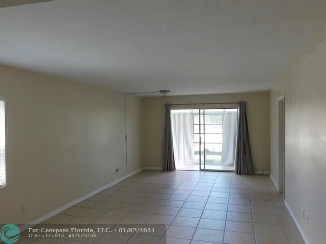 1166 6th Avenue, Unit A1 Vero Beach, FL 32960 - Photo 11 of 13 an empty room with windows