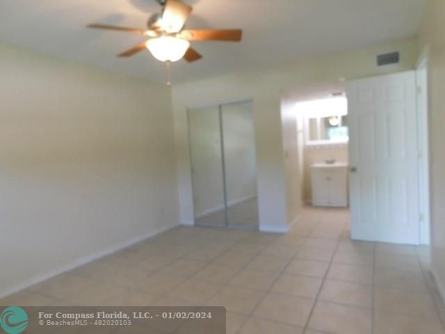 1166 6th Avenue, Unit A1 Vero Beach, FL 32960 - Photo 3 of 13 wooden floor in an empty room