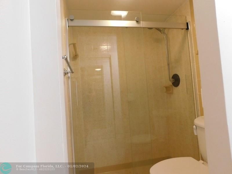 1166 6th Avenue, Unit A1 Vero Beach, FL 32960 - Photo 6 of 13 a bathroom with a shower and a toilet