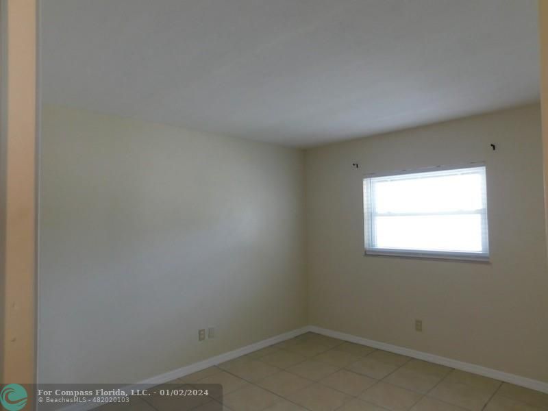 1166 6th Avenue, Unit A1 Vero Beach, FL 32960 - Photo 9 of 13 a view of a room that has a window in it