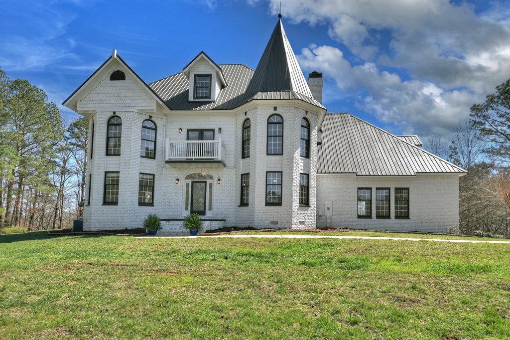 229 Crossroads Church Road Ellijay, GA 30540 - Photo 18 of 71 a front view of a house with garden