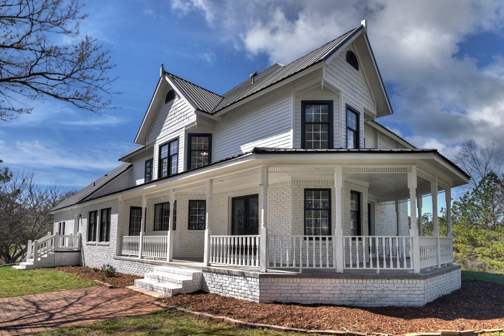 229 Crossroads Church Road Ellijay, GA 30540 - Photo 19 of 71 a front view of a house with garden