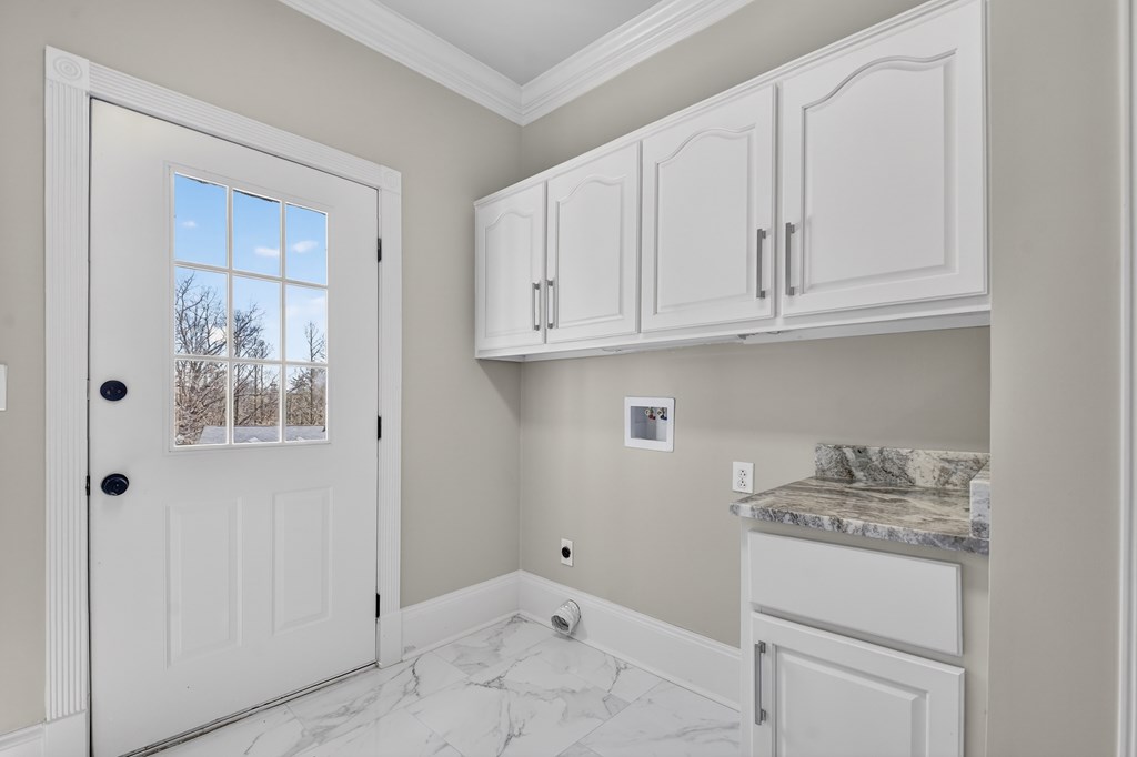229 Crossroads Church Road Ellijay, GA 30540 - Photo 25 of 71 a bathroom with a granite countertop sink and cabinets