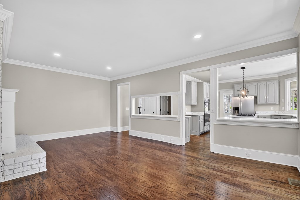 229 Crossroads Church Road Ellijay, GA 30540 - Photo 28 of 71 a large white kitchen with kitchen island a sink white cabinets and stainless steel appliances