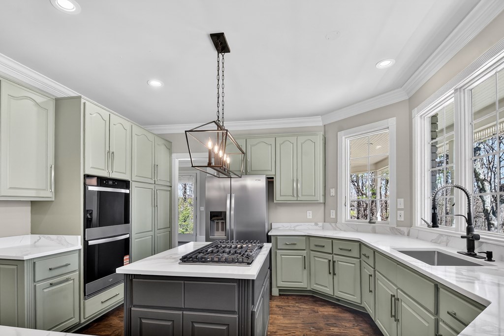 229 Crossroads Church Road Ellijay, GA 30540 - Photo 36 of 71 a kitchen with stainless steel appliances kitchen island a refrigerator sink and stove