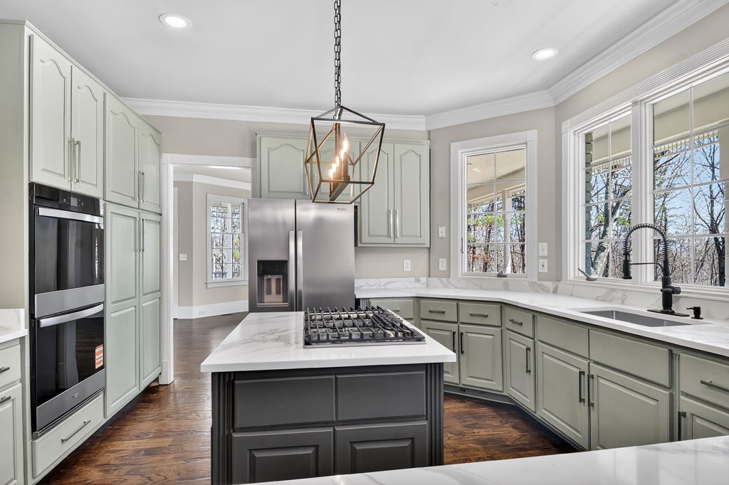 229 Crossroads Church Road Ellijay, GA 30540 - Photo 37 of 71 a kitchen with stainless steel appliances a sink stove and refrigerator