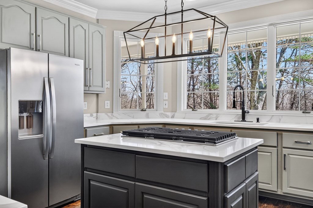 229 Crossroads Church Road Ellijay, GA 30540 - Photo 38 of 71 a kitchen with stainless steel appliances granite countertop a sink and a refrigerator