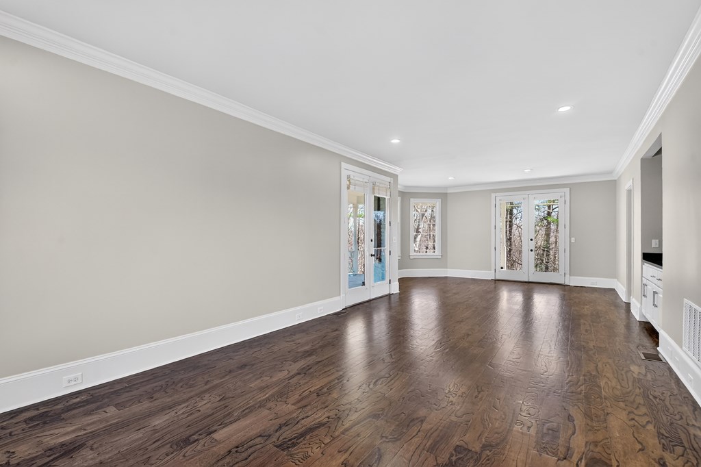 229 Crossroads Church Road Ellijay, GA 30540 - Photo 40 of 71 a view of an empty room with wooden floor and window