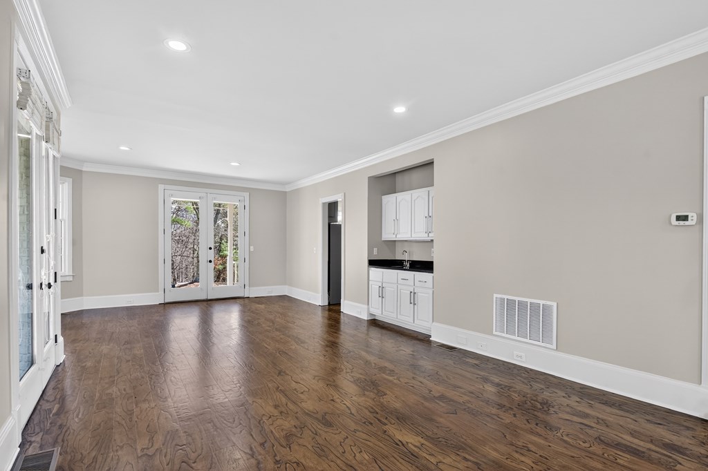 229 Crossroads Church Road Ellijay, GA 30540 - Photo 41 of 71 a view of an empty room with window and wooden floor