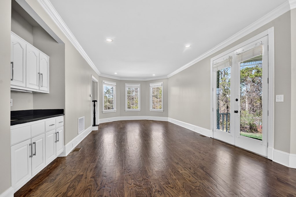 229 Crossroads Church Road Ellijay, GA 30540 - Photo 43 of 71 a view of an empty room with wooden floor and a window