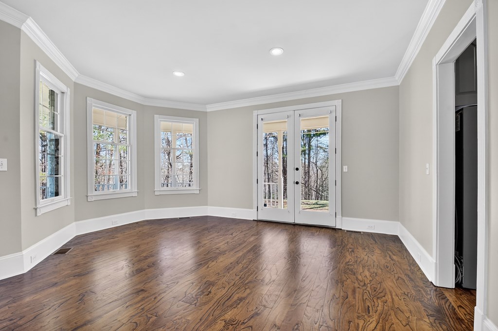 229 Crossroads Church Road Ellijay, GA 30540 - Photo 44 of 71 a view of an empty room with wooden floor and a window