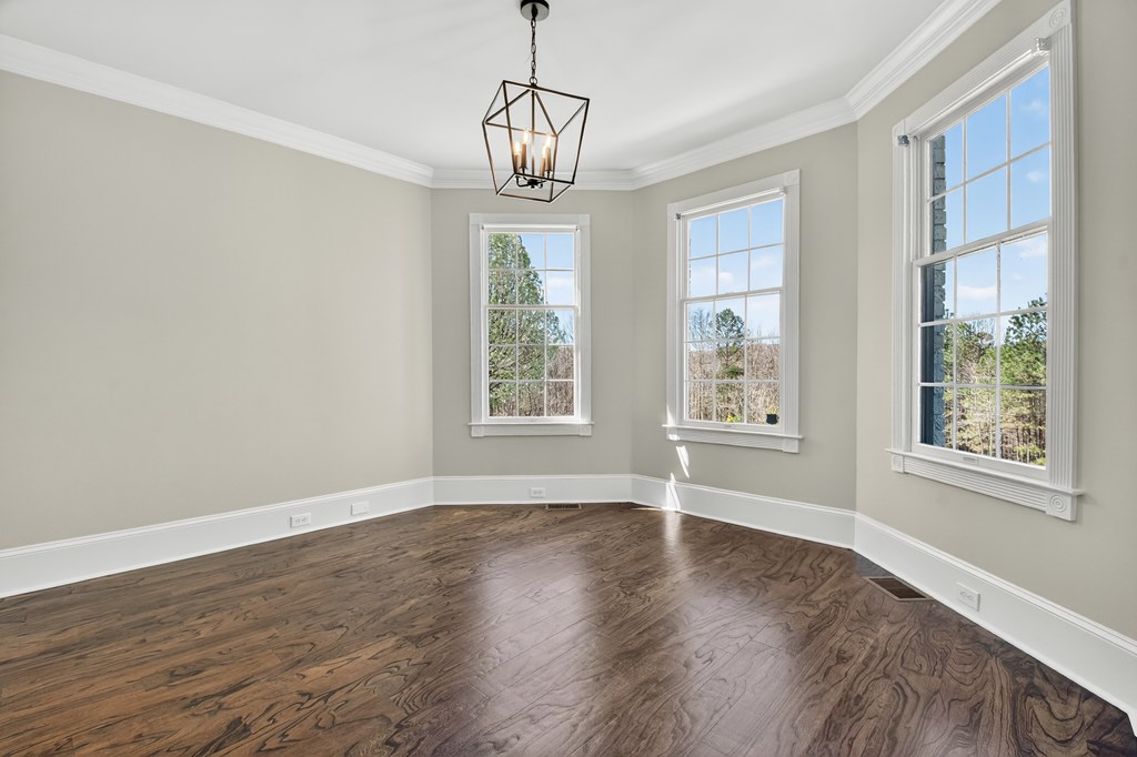 229 Crossroads Church Road Ellijay, GA 30540 - Photo 45 of 71 a view of an empty room with wooden floor and a window
