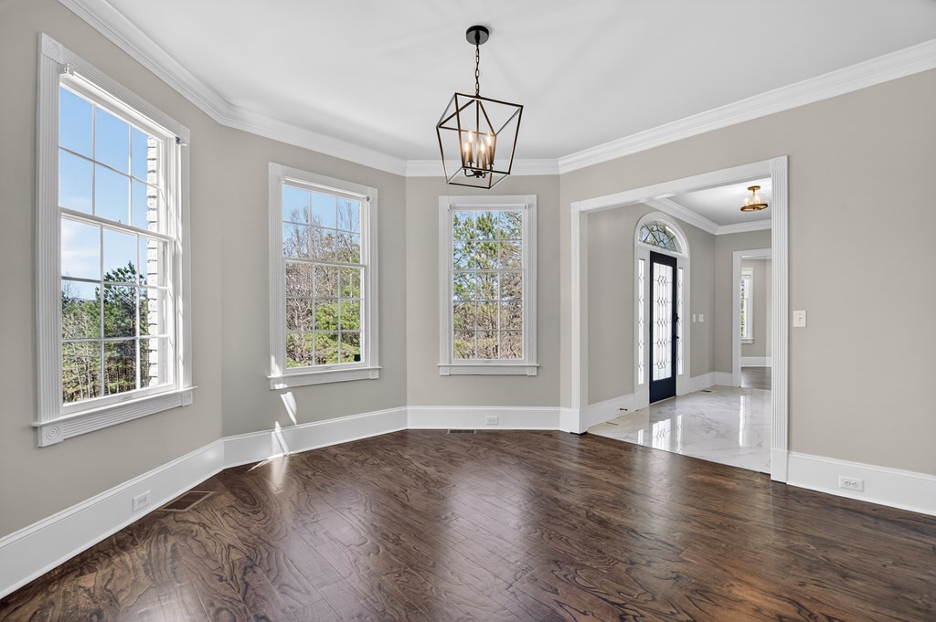 229 Crossroads Church Road Ellijay, GA 30540 - Photo 46 of 71 a view of an empty room with wooden floor and a window