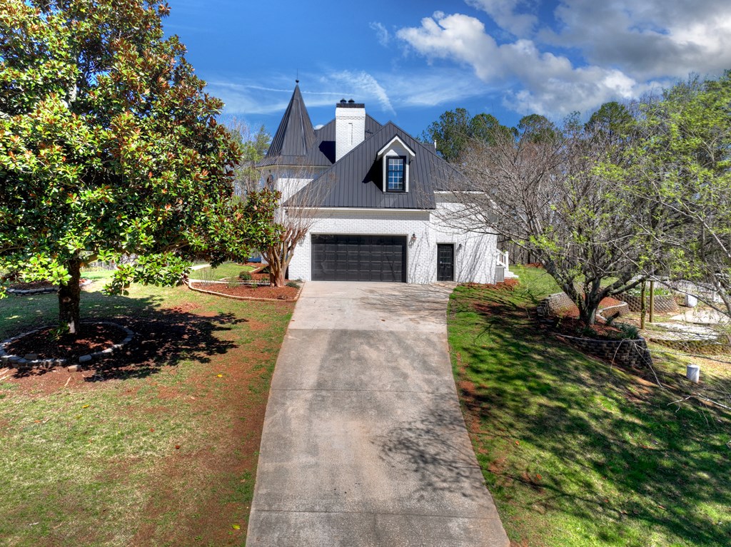 229 Crossroads Church Road Ellijay, GA 30540 - Photo 71 of 71 a front view of a house with a yard and garage