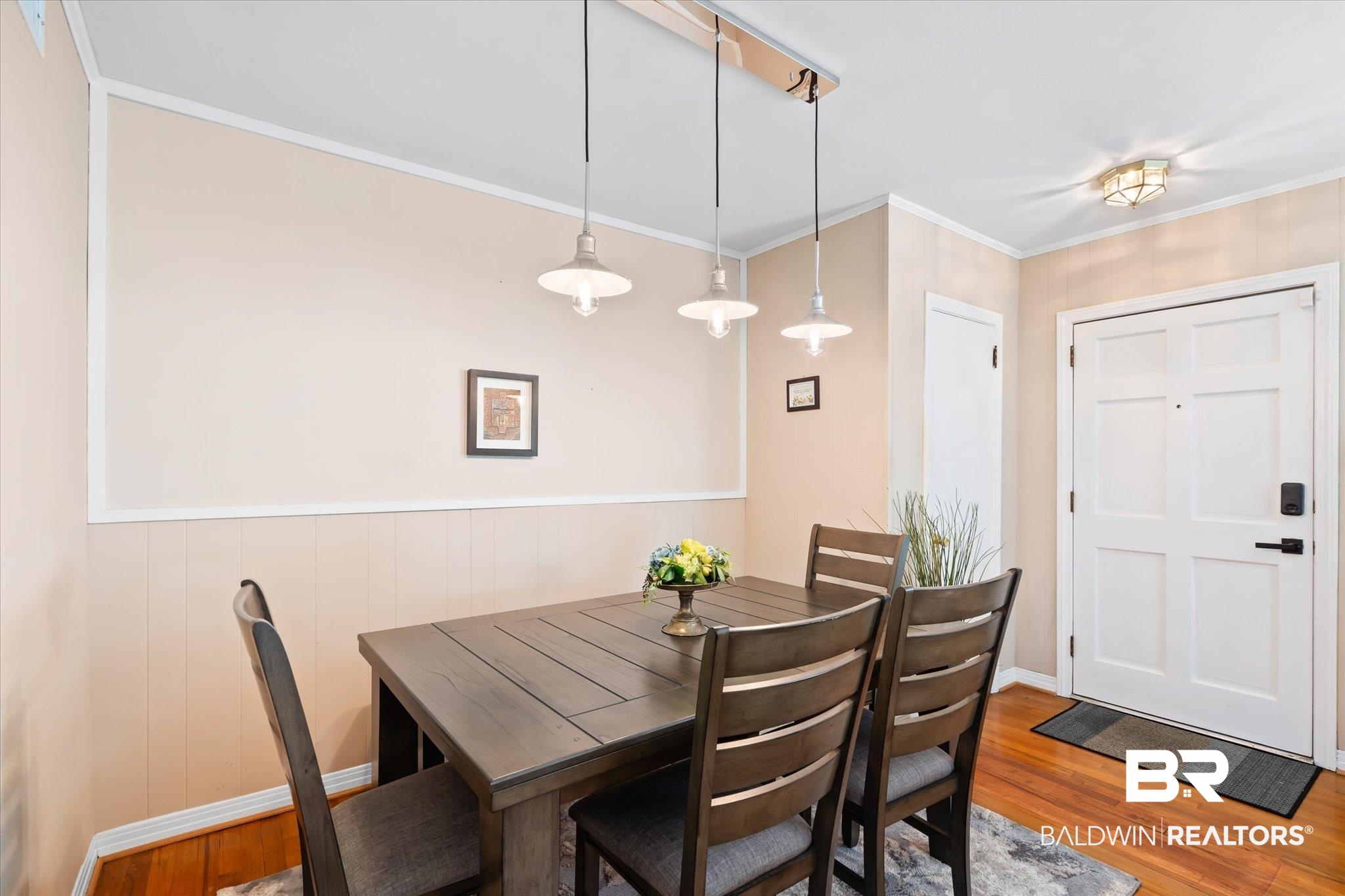 162 Bit And Spur Terrace Mobile, AL 36608 - Photo 4 of 29 Dining space with crown molding and hardwood / wood-style flooring