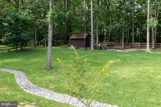 a backyard of a house with lots of green space