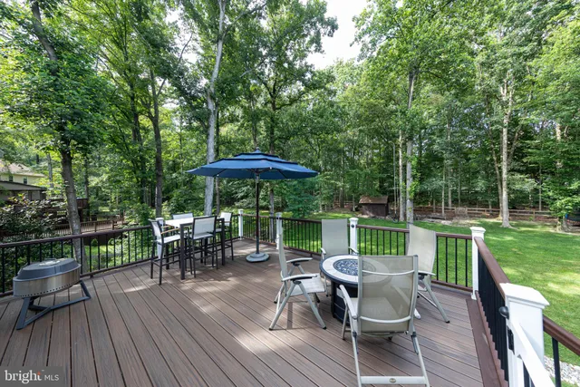 a view of a porch with furniture and garden
