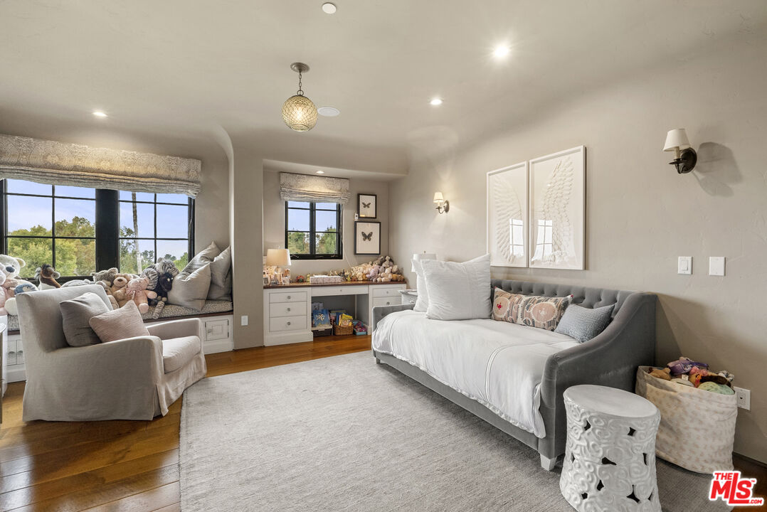 361 Fordyce Road Los Angeles, CA 90049 - Photo 21 of 40 a spacious bedroom with a bed and couch