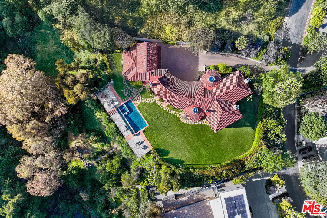 361 Fordyce Road Los Angeles, CA 90049 - Photo 39 of 40 an aerial view of a house with a garden and trees