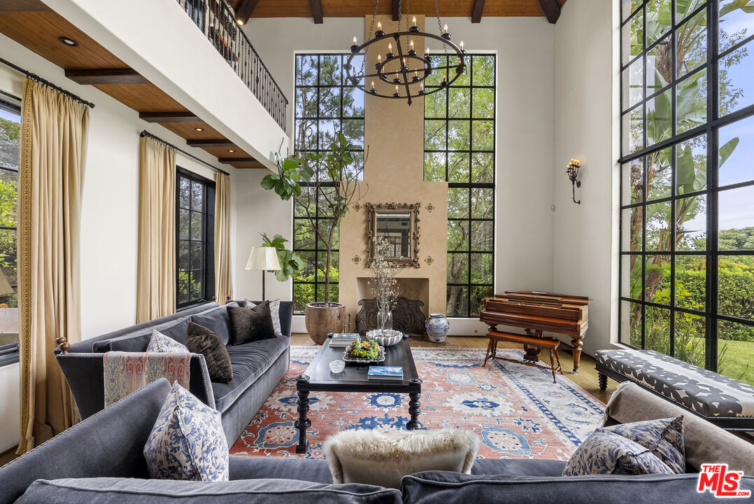 361 Fordyce Road Los Angeles, CA 90049 - Photo 6 of 40 a living room with furniture and a floor to ceiling window
