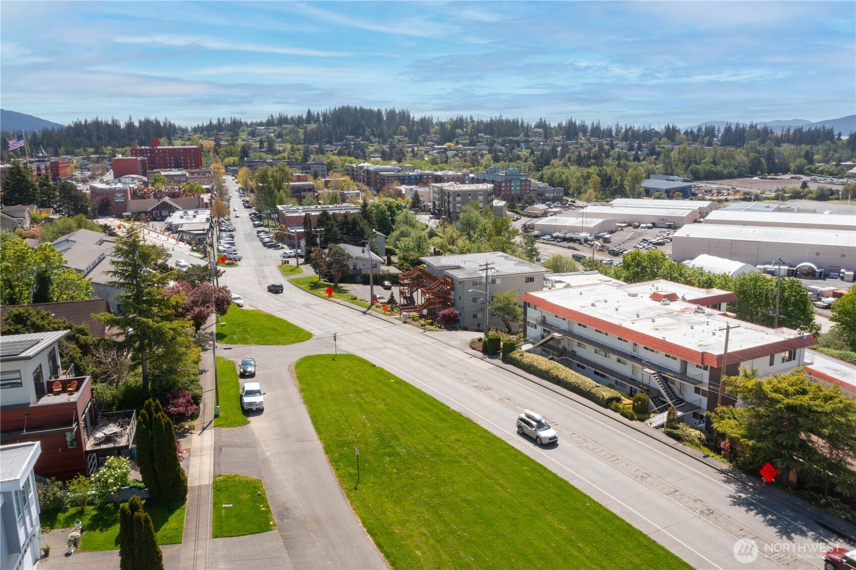 1014 11th Street, Unit 302 Bellingham, WA 98225 - Photo 1 of 30 an aerial view of a house with a garden