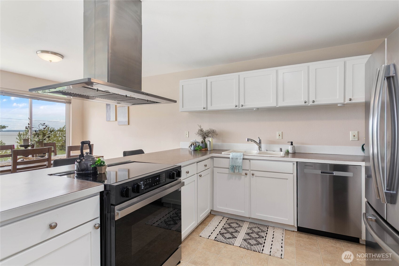 1014 11th Street, Unit 302 Bellingham, WA 98225 - Photo 11 of 30 a kitchen with a sink stove and cabinets