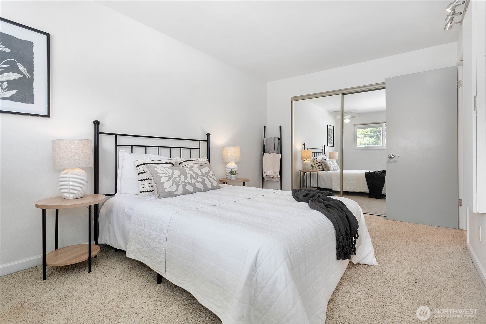 1014 11th Street, Unit 302 Bellingham, WA 98225 - Photo 14 of 30 a bedroom with a bed and lamp